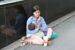 Young mother begging